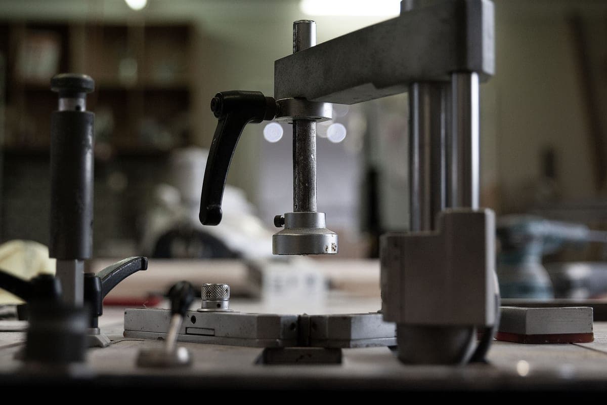 Pneumatic tools laid out on a workshop bench